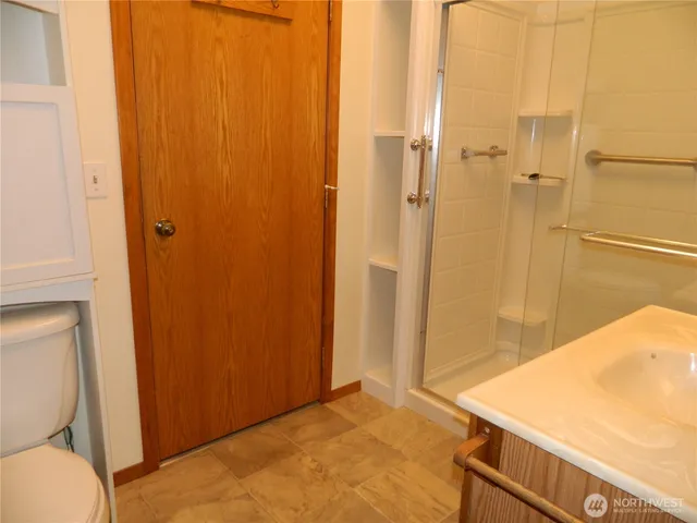 a bathroom with a tub and shower