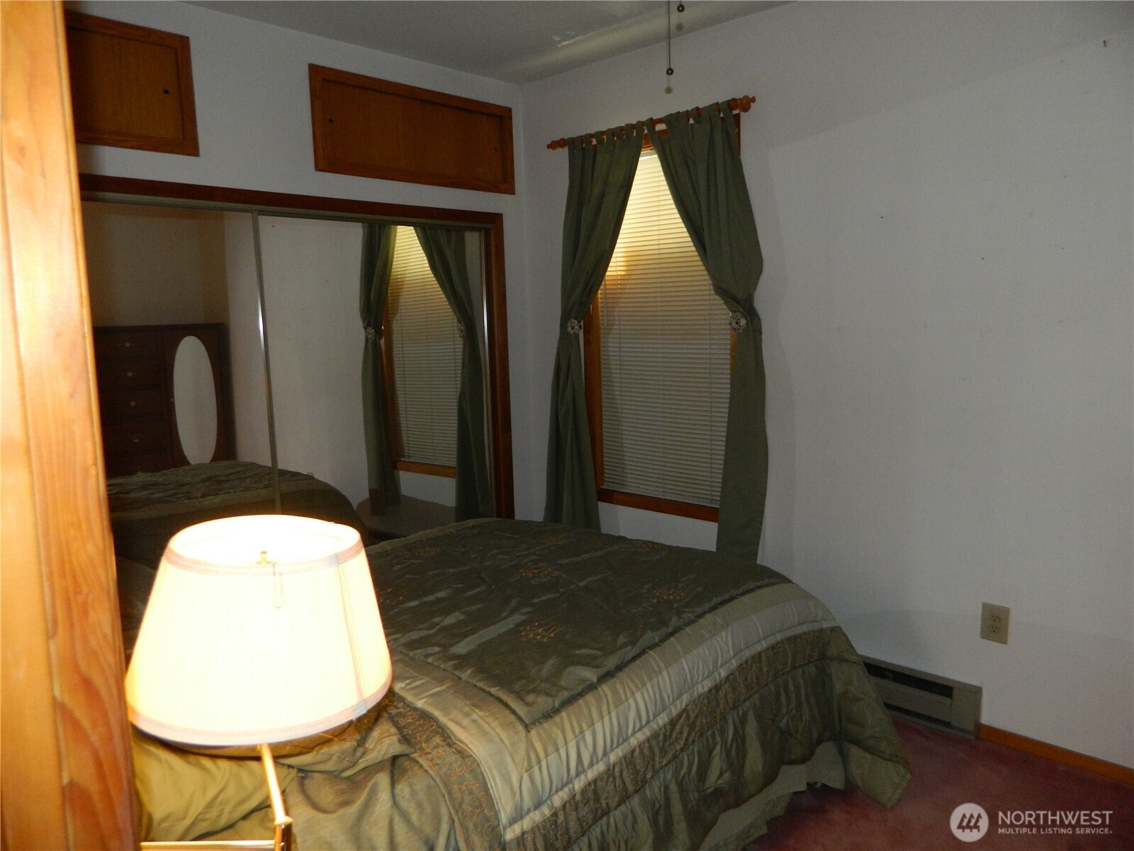 19 3rd Street Tonasket, WA 98855 - Photo 13 of 21 a bed room with a bed and chair