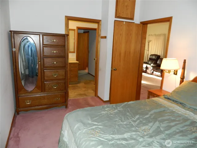 a bedroom with a bed and furniture