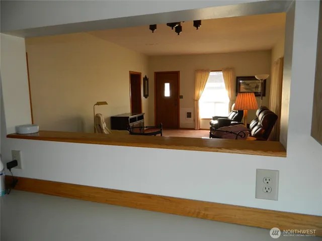 a view of a living room with a large window