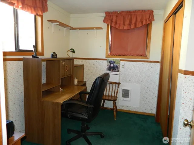a balcony with table and chairs