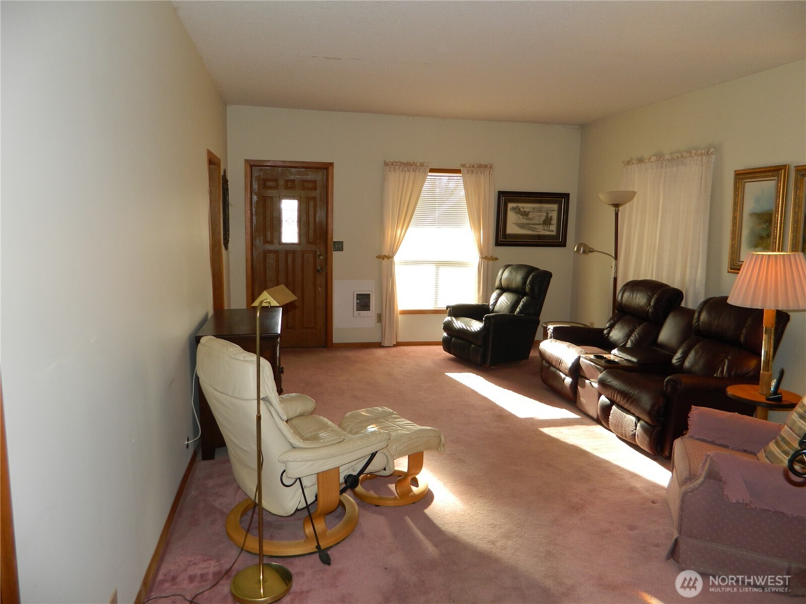 19 3rd Street Tonasket, WA 98855 - Photo 20 of 21 a living room with furniture a window and a potted plant