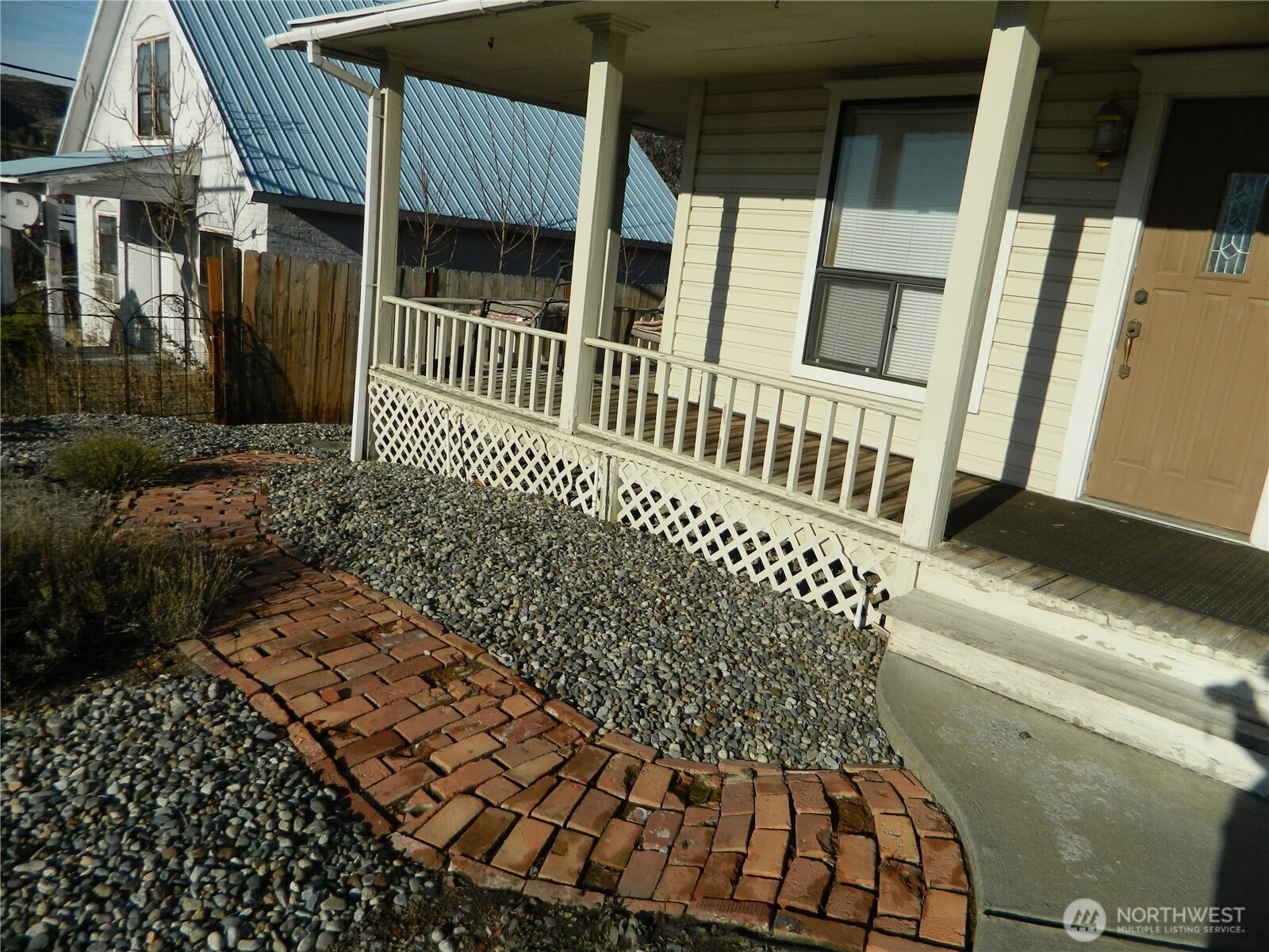 19 3rd Street Tonasket, WA 98855 - Photo 2 of 21 a view of a house with a bench