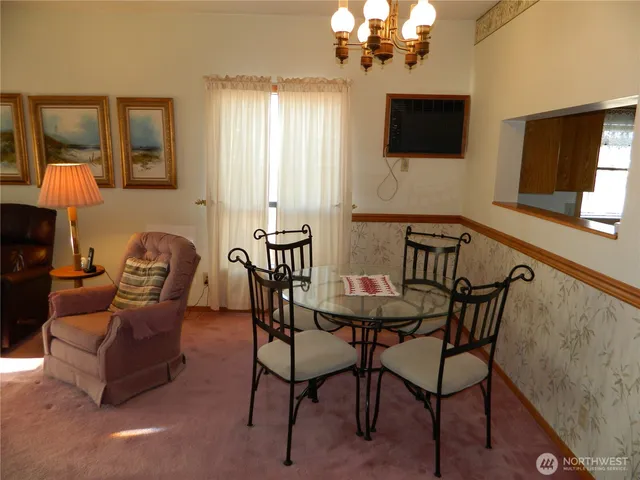 a view of a livingroom with furniture and a flat screen tv