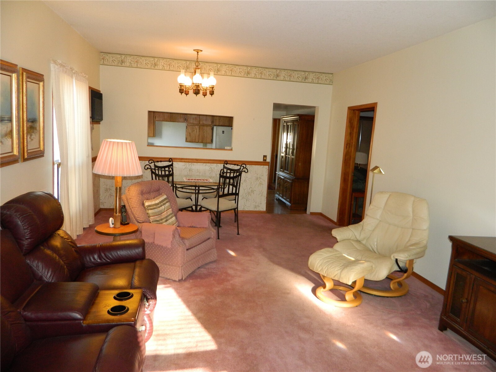 19 3rd Street Tonasket, WA 98855 - Photo 9 of 21 a living room with furniture and a chandelier