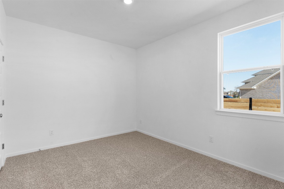 417 Raleigh Drive Georgetown, TX 78633 - Photo 14 of 29 Carpeted empty room featuring baseboards