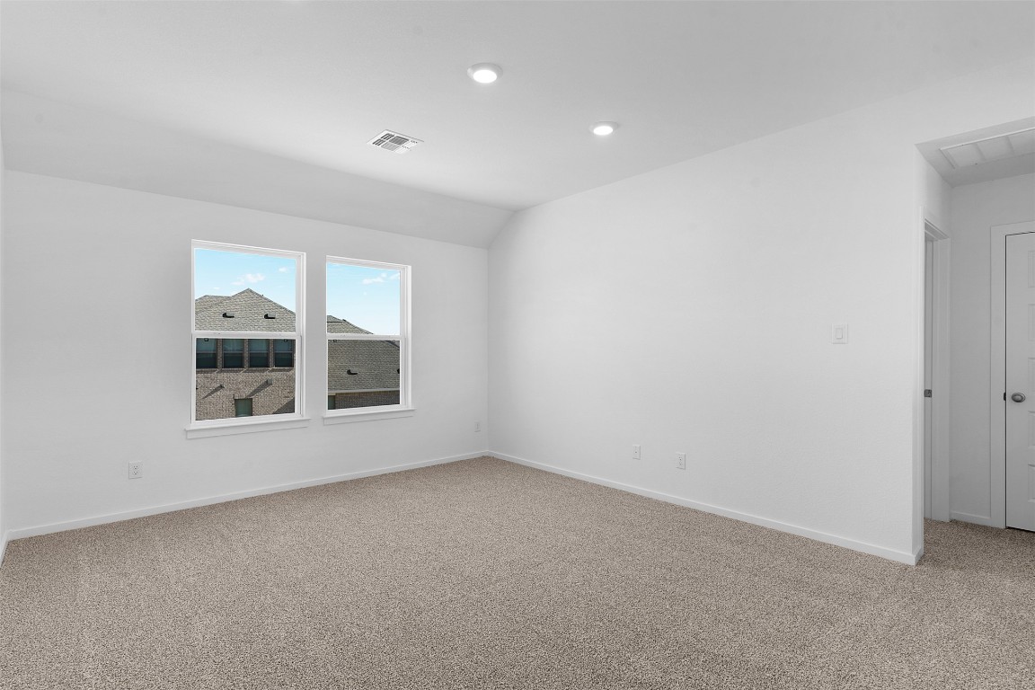 417 Raleigh Drive Georgetown, TX 78633 - Photo 16 of 29 Unfurnished room featuring light carpet and lofted ceiling