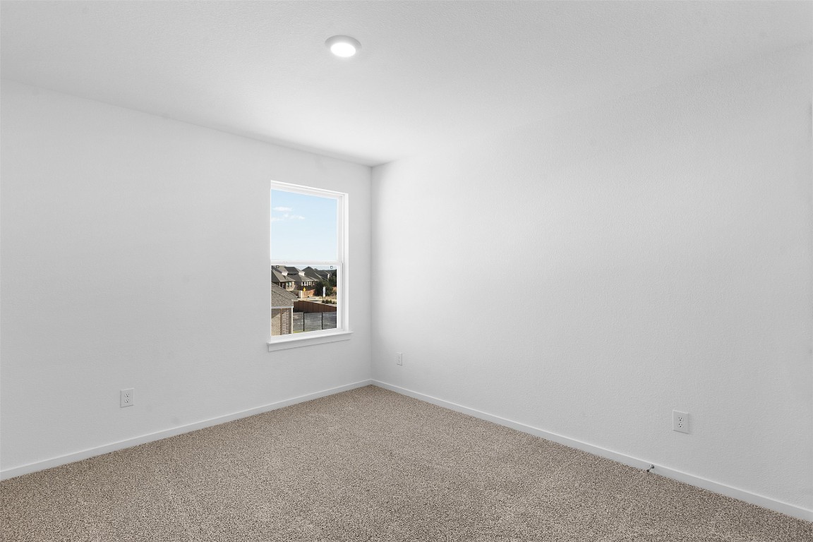 417 Raleigh Drive Georgetown, TX 78633 - Photo 17 of 29 Spare room with baseboards and carpet