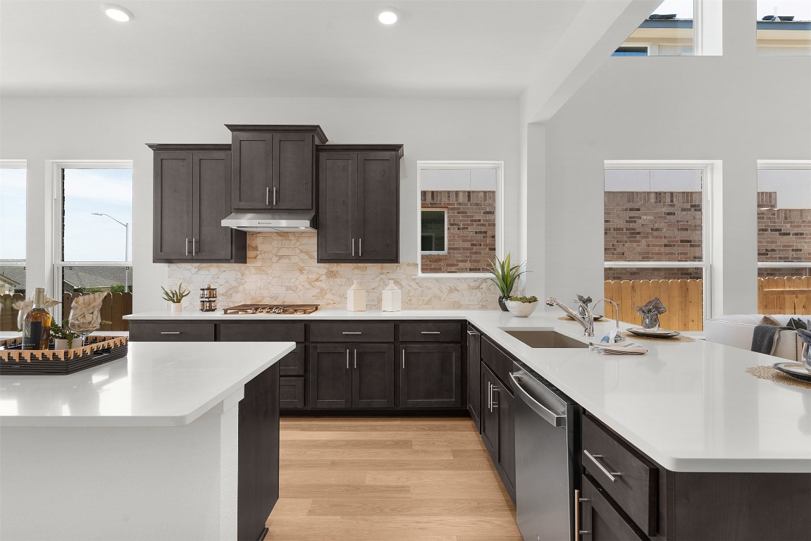 417 Raleigh Drive Georgetown, TX 78633 - Photo 28 of 40 a kitchen with a sink stove and cabinets