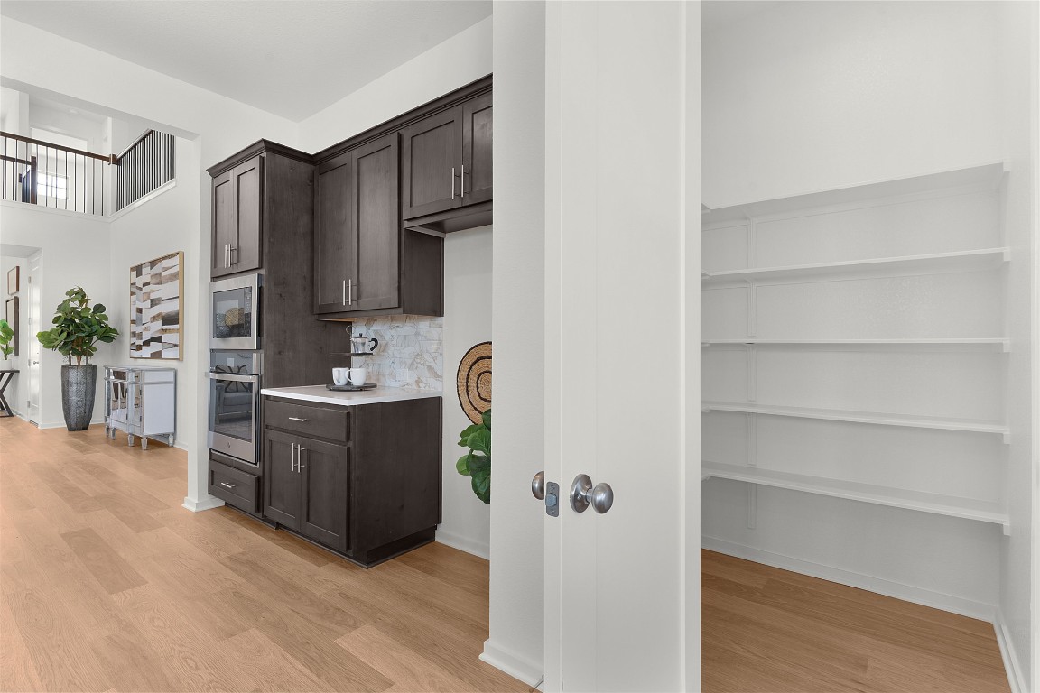 417 Raleigh Drive Georgetown, TX 78633 - Photo 30 of 40 a room with a cabinets and a television