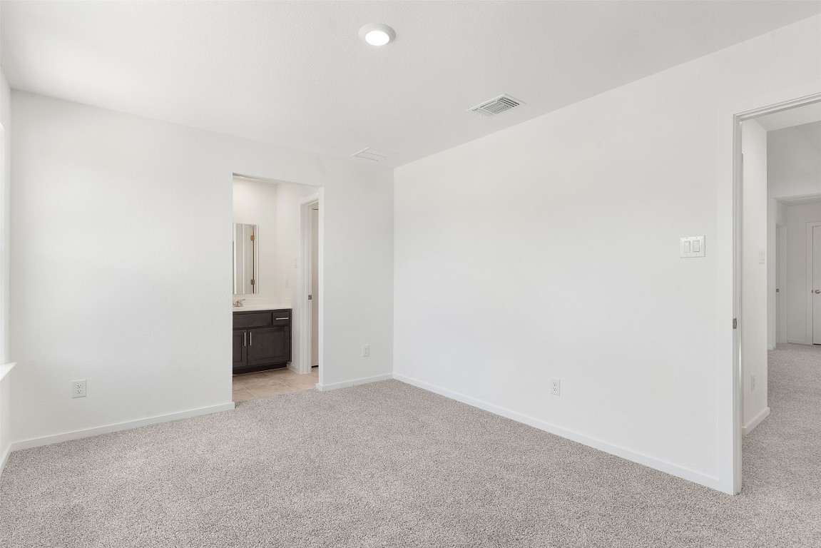 417 Raleigh Drive Georgetown, TX 78633 - Photo 38 of 40 a view of an empty room with a kitchen