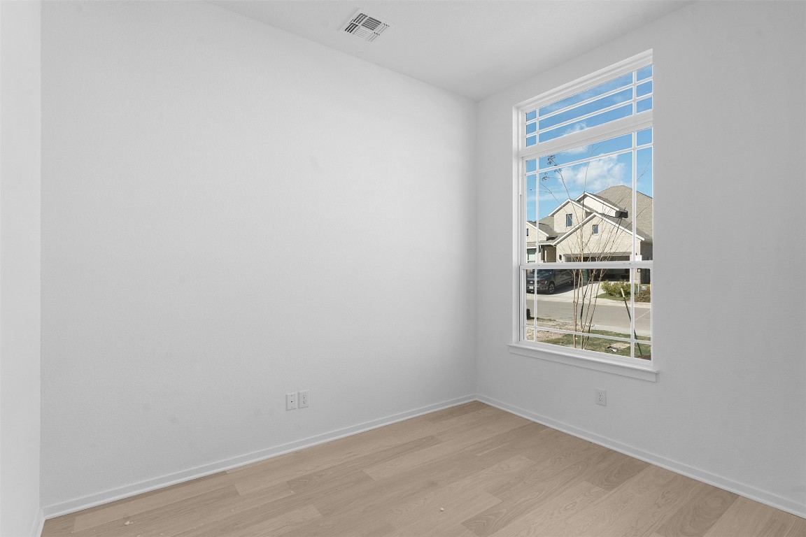 417 Raleigh Drive Georgetown, TX 78633 - Photo 4 of 29 Spare room with light wood-style flooring and baseboards