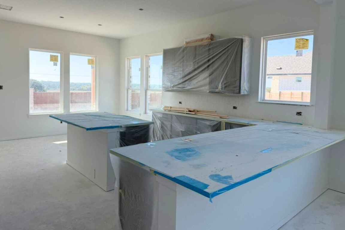 417 Raleigh Drive Georgetown, TX 78633 - Photo 6 of 40 a kitchen with stainless steel appliances granite countertop a sink stove and cabinets