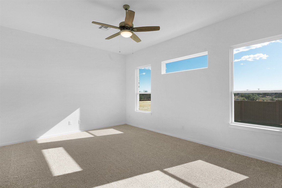 417 Raleigh Drive Georgetown, TX 78633 - Photo 10 of 29 Spare room featuring carpet floors and a ceiling fan