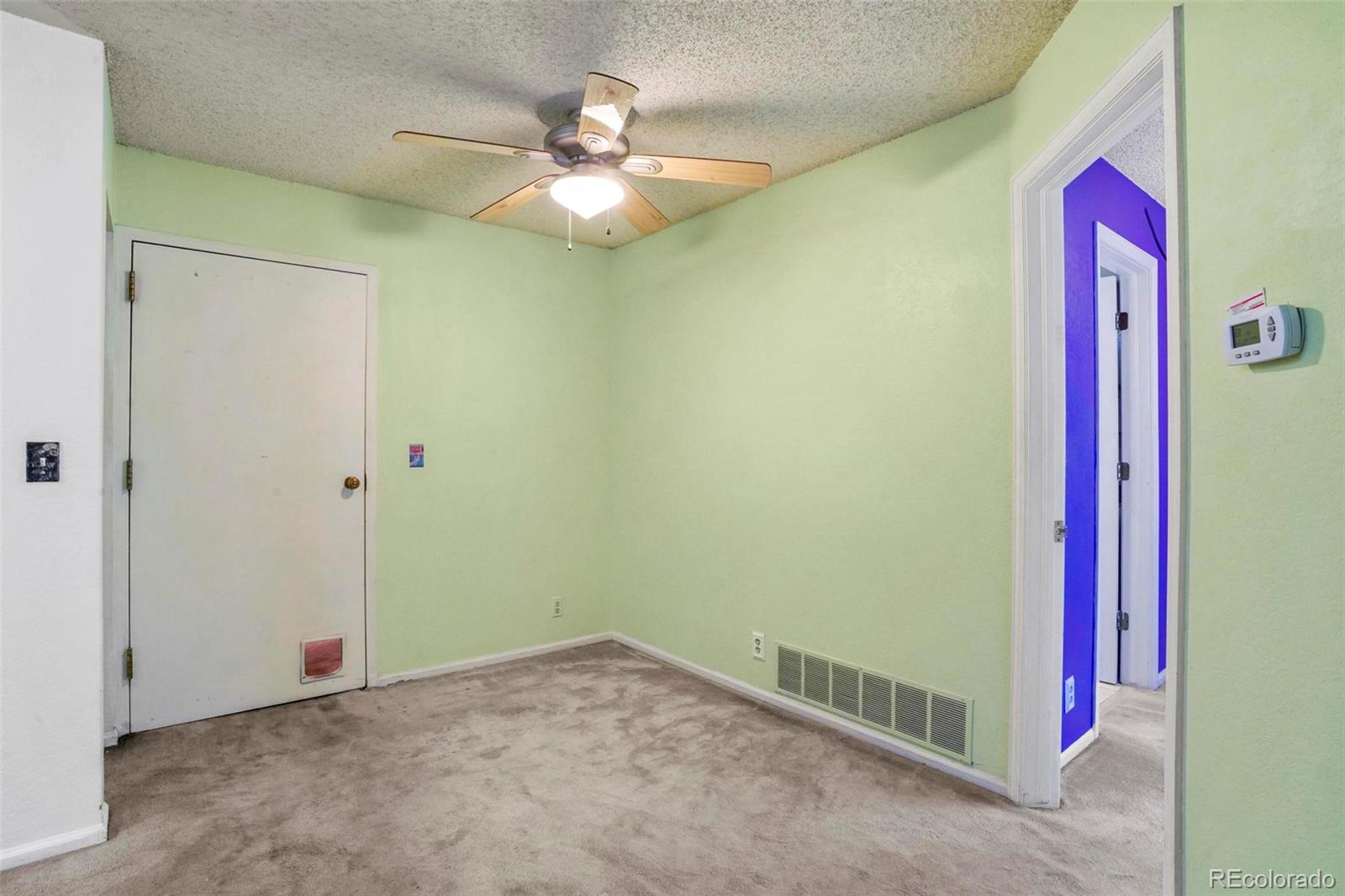 2 Acoma Street, Unit 1 Denver, CO 80223 - Photo 11 of 23 a view of a room with a ceiling fan