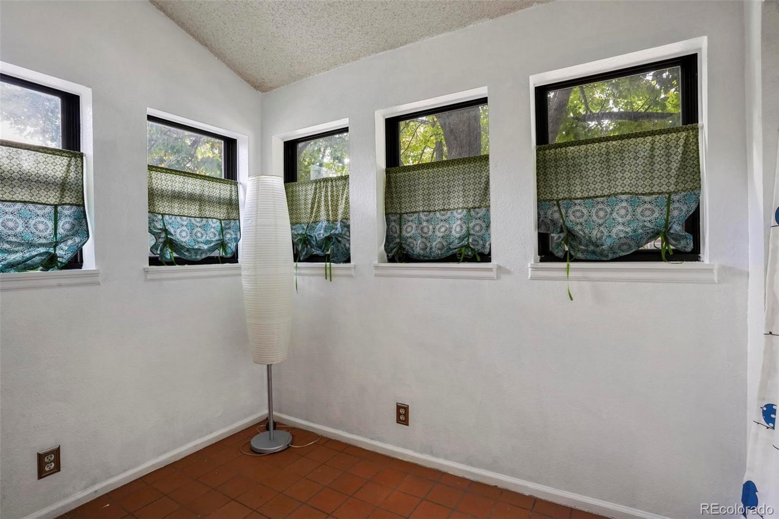 2 Acoma Street, Unit 1 Denver, CO 80223 - Photo 18 of 23 an empty room with windows