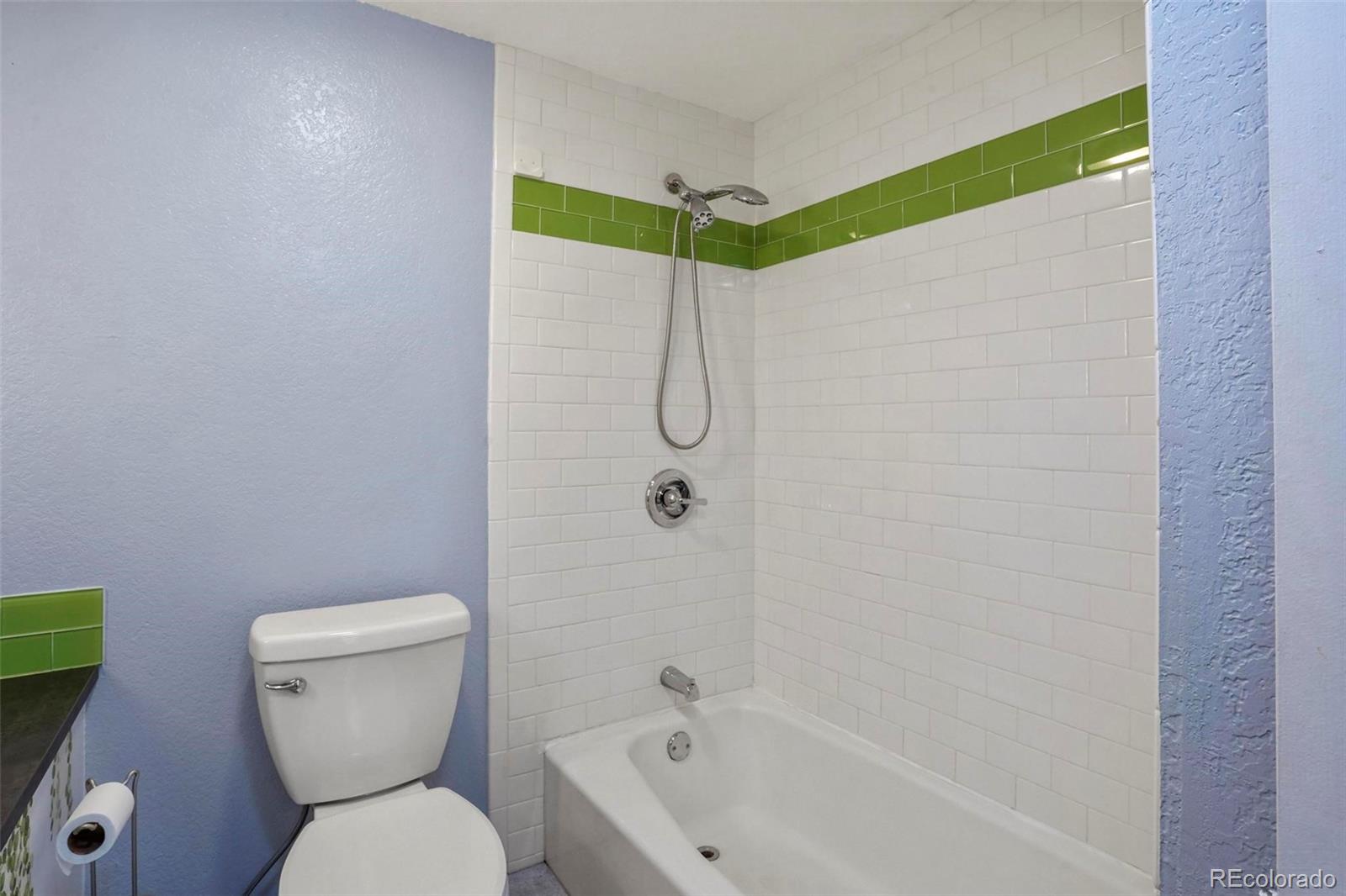 2 Acoma Street, Unit 1 Denver, CO 80223 - Photo 21 of 23 a bathroom with a toilet and shower