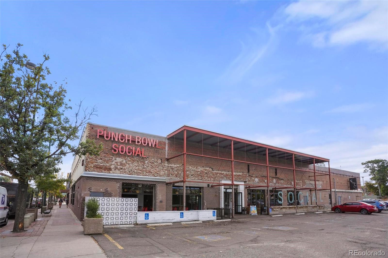 2 Acoma Street, Unit 1 Denver, CO 80223 - Photo 22 of 23 a front view of a building with parking