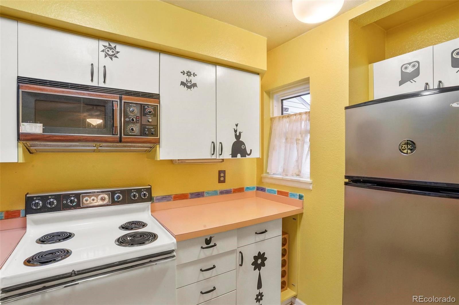 2 Acoma Street, Unit 1 Denver, CO 80223 - Photo 10 of 23 a utility room with washer and dryer