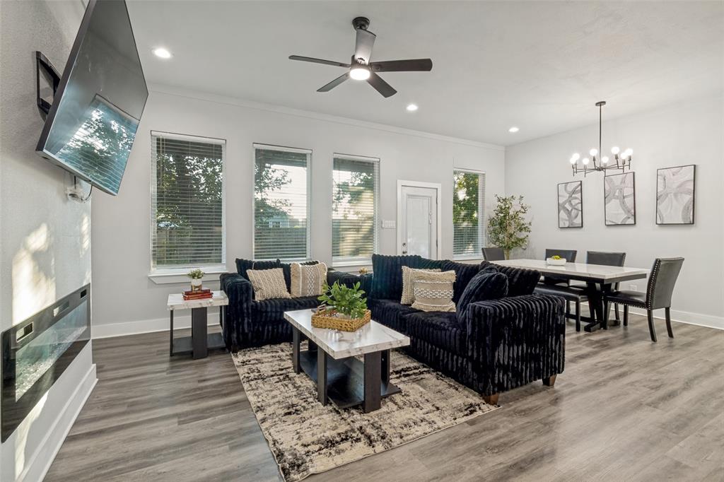 7909 Ivory Lane Dallas, TX 75216 - Photo 9 of 20 a living room with furniture and a flat screen tv
