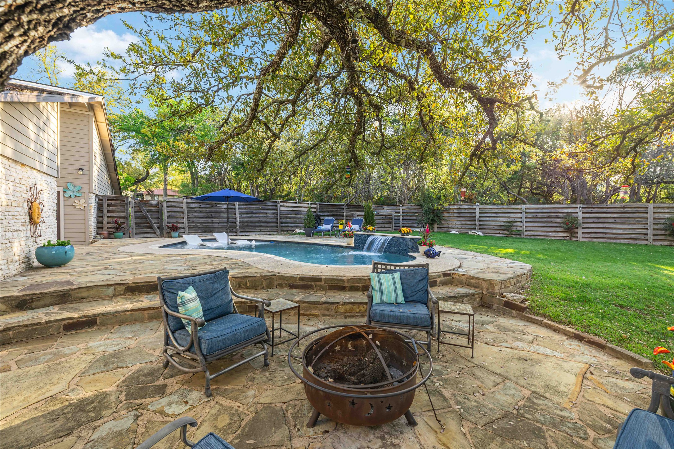 10903 Cade Circle Austin, TX 78726 - Photo 14 of 40 Fenced backyard featuring a patio area and a fire pit