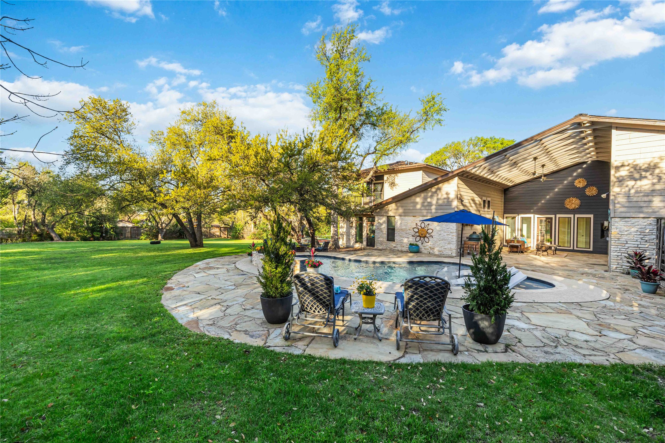 10903 Cade Circle Austin, TX 78726 - Photo 15 of 40 View of green lawn featuring a patio and an outdoor pool