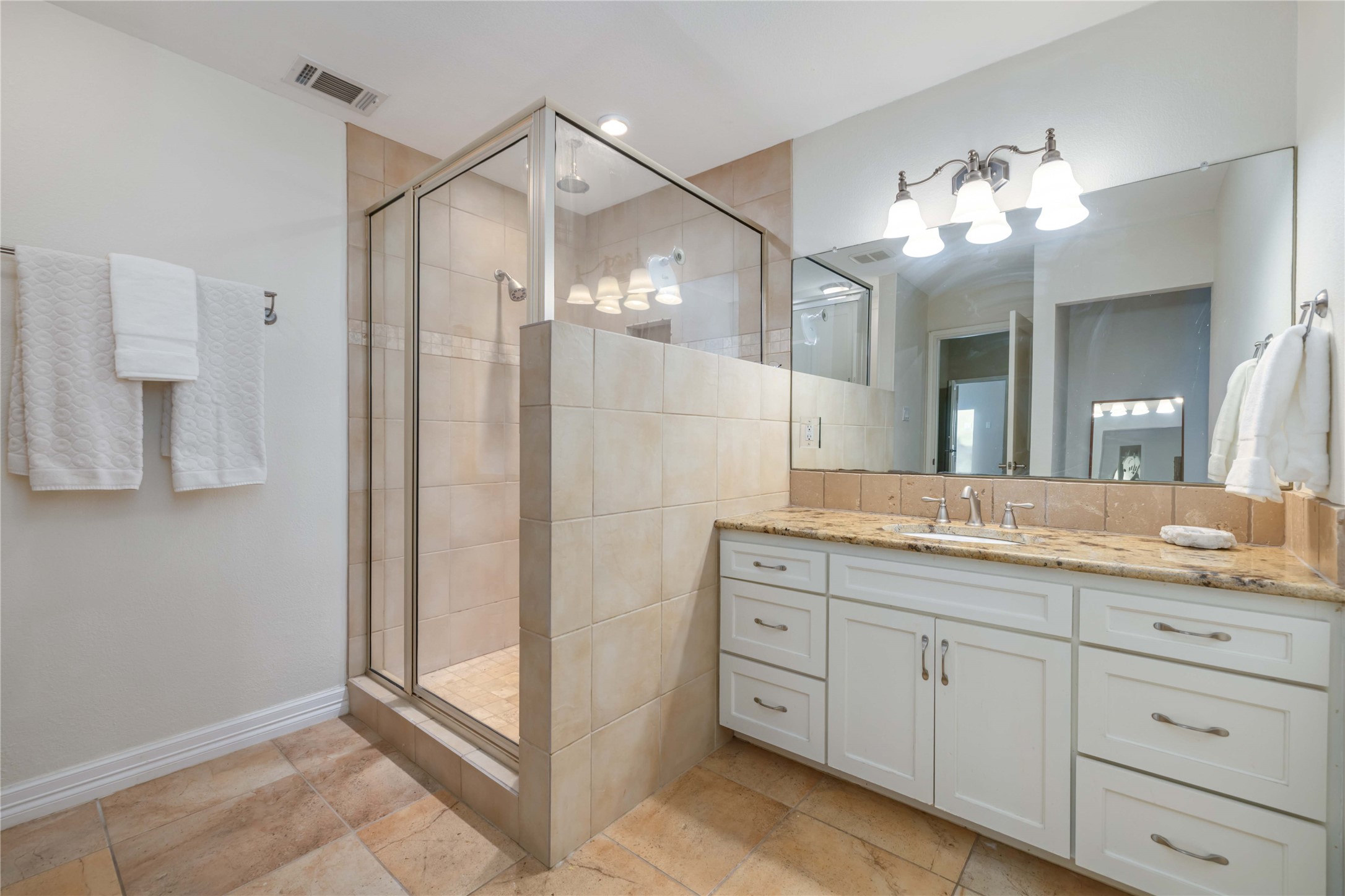 10903 Cade Circle Austin, TX 78726 - Photo 31 of 40 Bathroom featuring vanity and a shower stall