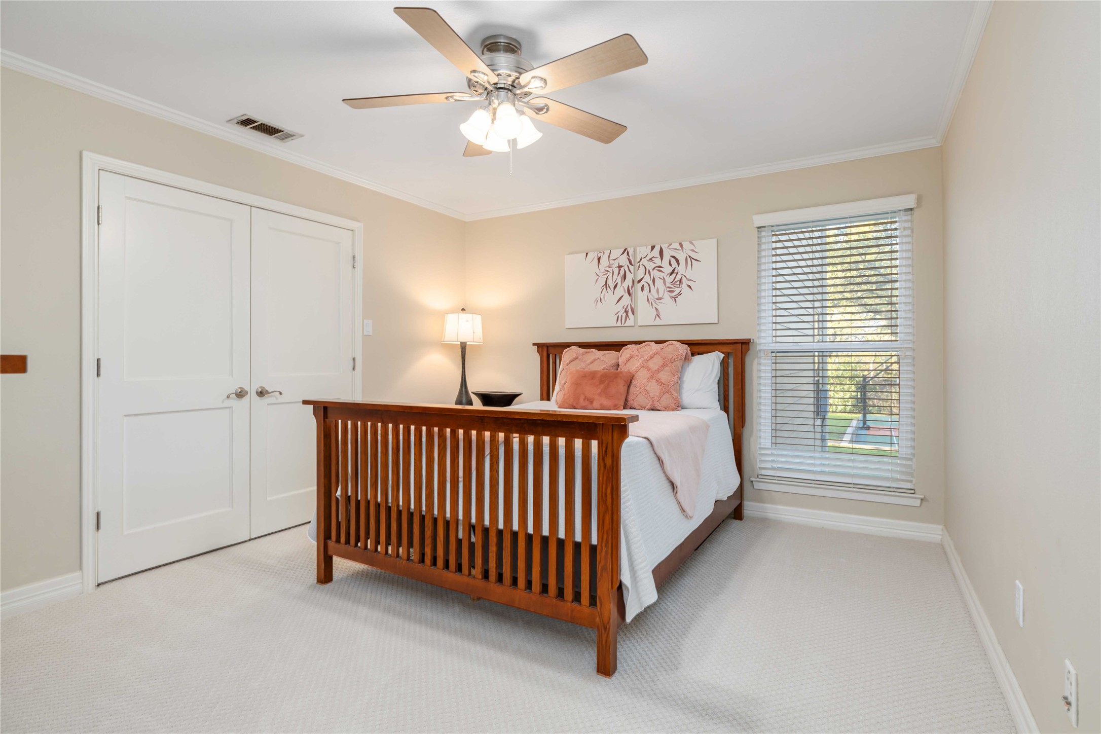 10903 Cade Circle Austin, TX 78726 - Photo 32 of 40 Bedroom with ornamental molding, light colored carpet, a closet, and ceiling fan