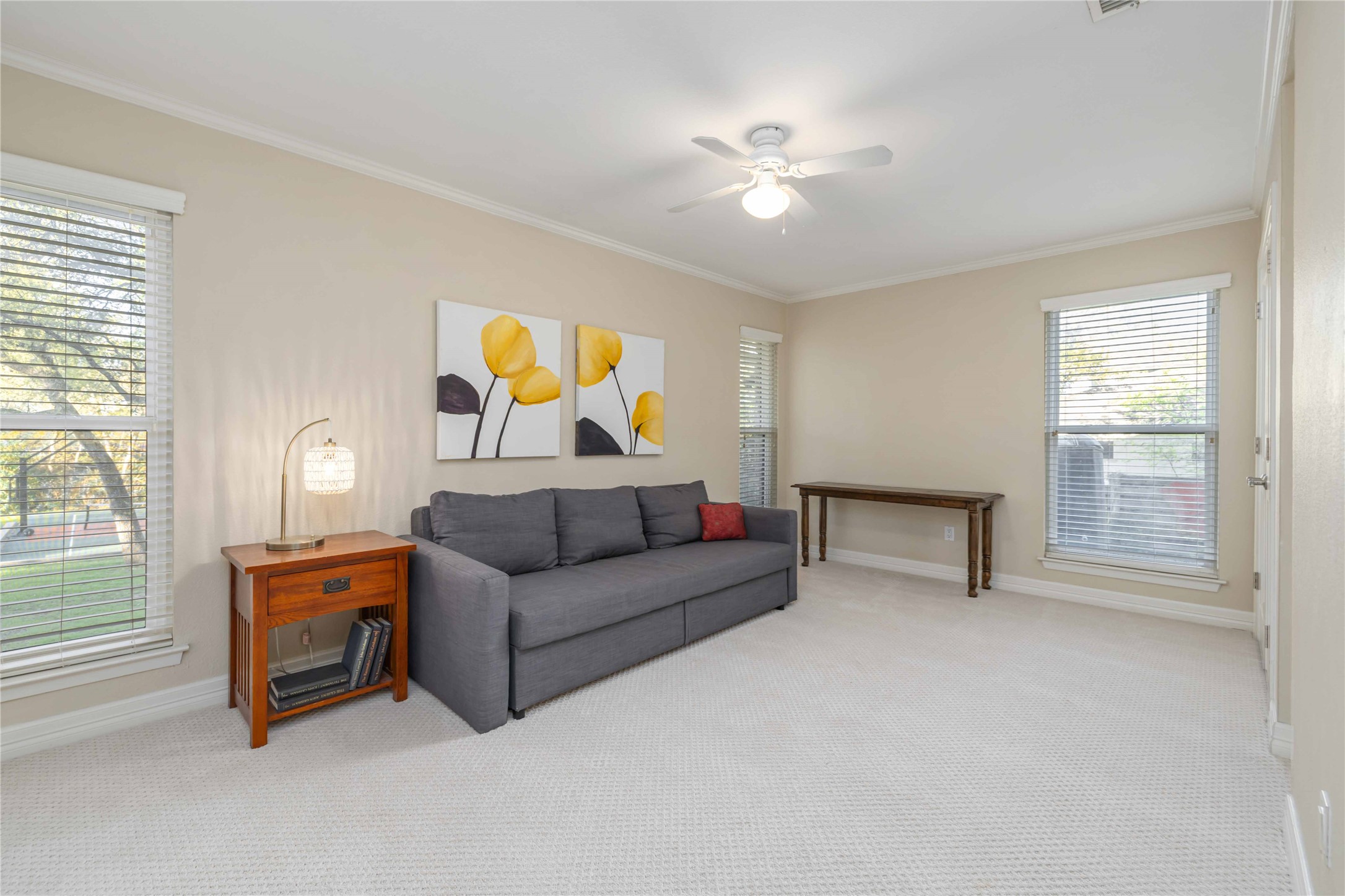 10903 Cade Circle Austin, TX 78726 - Photo 33 of 40 Sitting room featuring light colored carpet, ornamental molding, and a ceiling fan