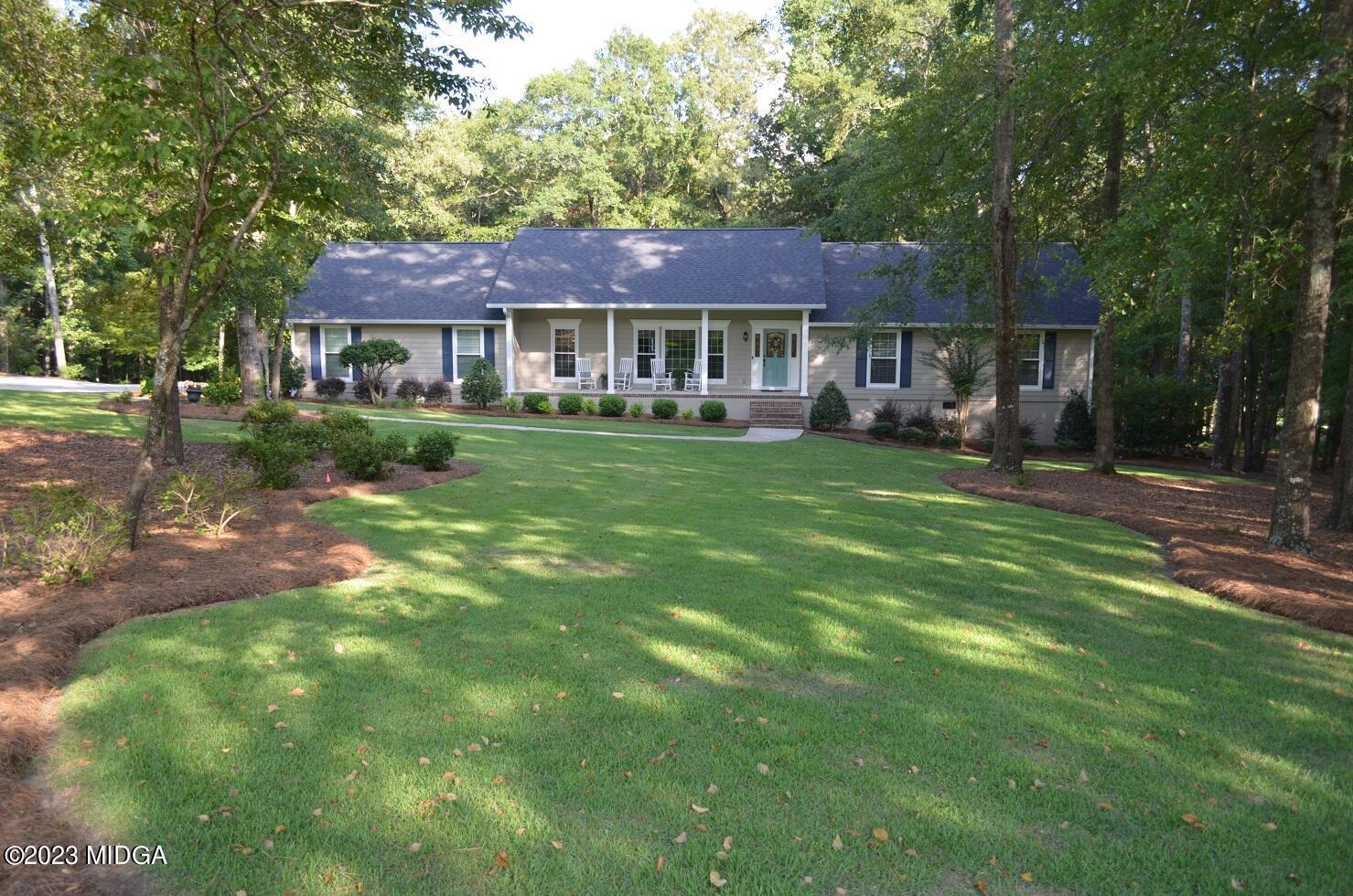 76 Riverside Landing Macon, GA 31210 - Photo 1 of 44 a front view of a house with garden