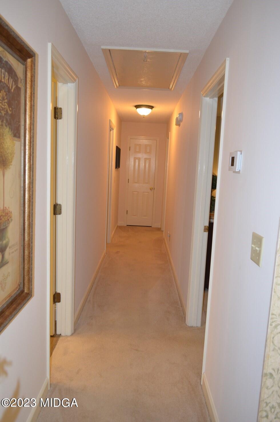 76 Riverside Landing Macon, GA 31210 - Photo 17 of 44 a view of a hallway with wooden floor and staircase