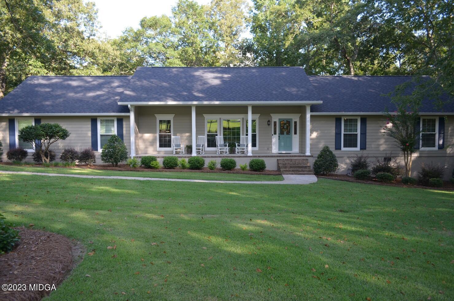 76 Riverside Landing Macon, GA 31210 - Photo 2 of 44 a view of a house with a yard and potted plants
