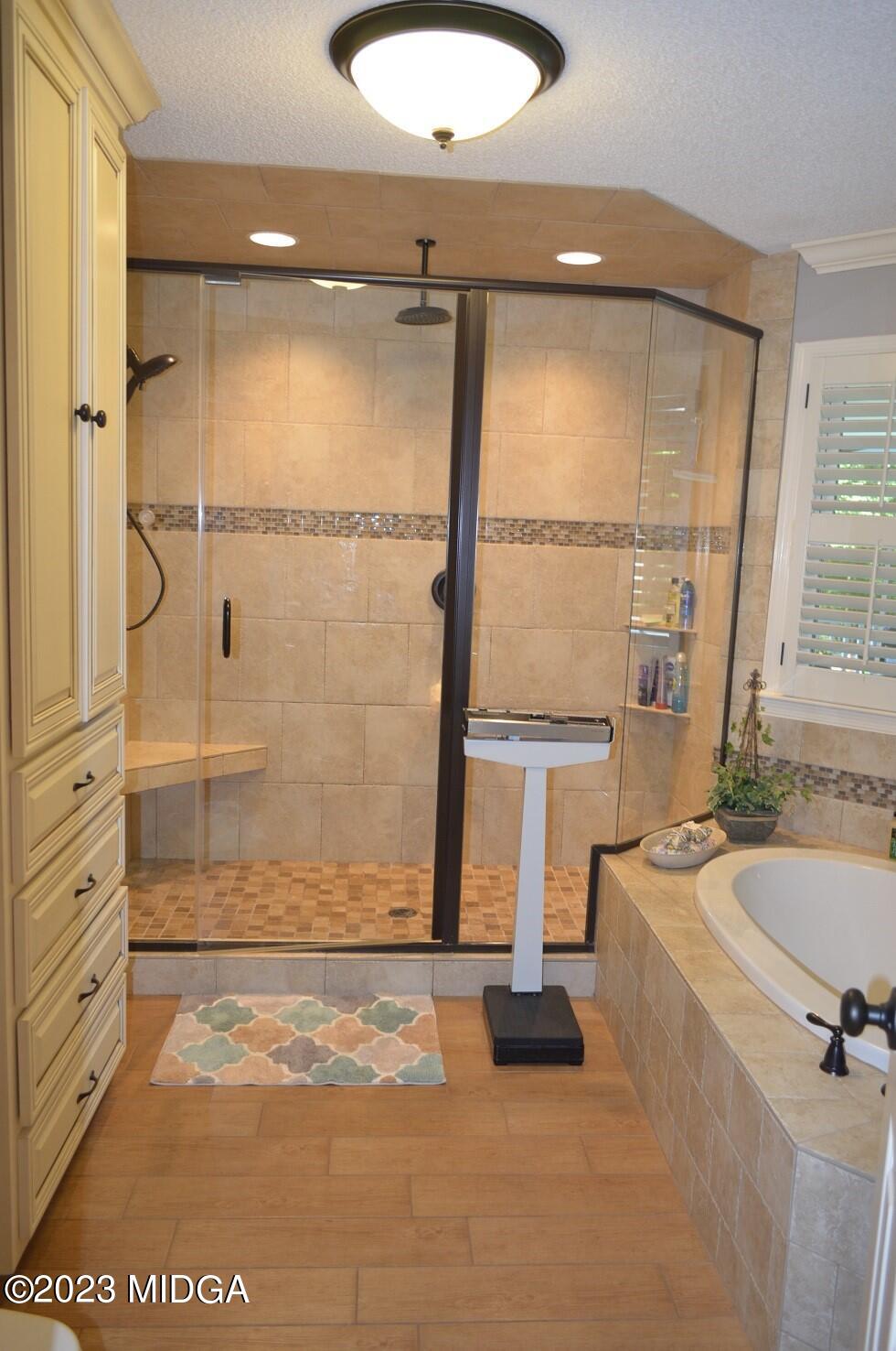 76 Riverside Landing Macon, GA 31210 - Photo 22 of 44 a bathroom with a tub and a shower