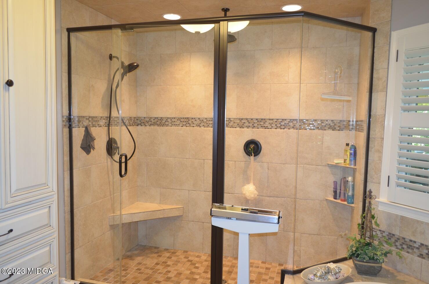 76 Riverside Landing Macon, GA 31210 - Photo 23 of 44 a bathroom with a glass shower door