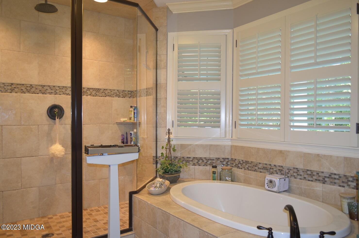 76 Riverside Landing Macon, GA 31210 - Photo 24 of 44 a bathroom with a tub a sink and a window