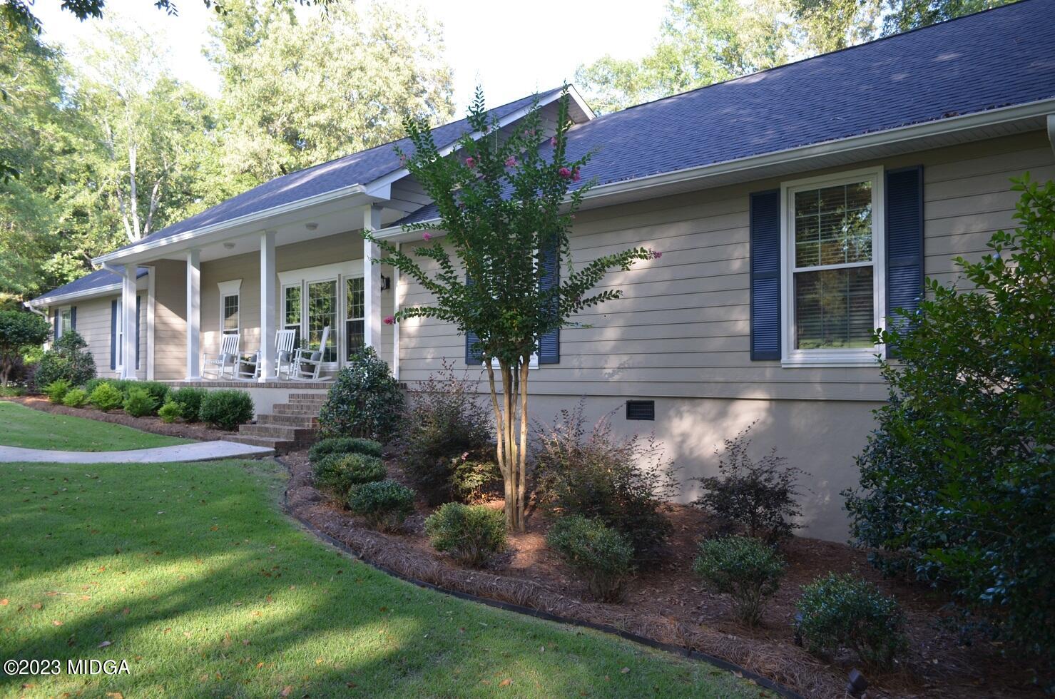 76 Riverside Landing Macon, GA 31210 - Photo 3 of 44 a front view of a house with garden