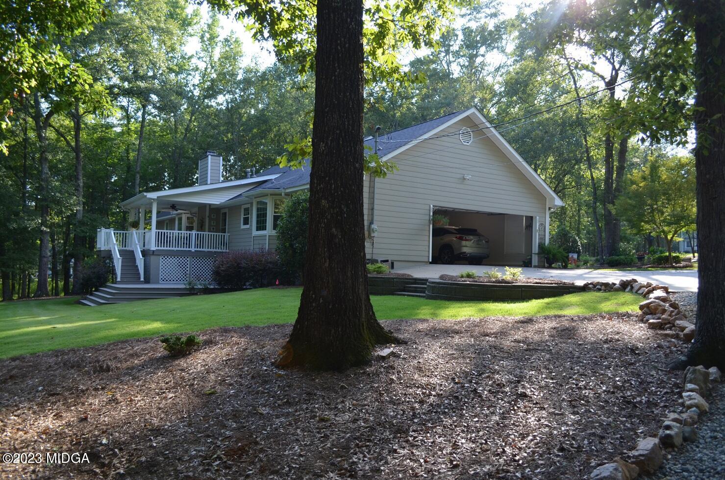 76 Riverside Landing Macon, GA 31210 - Photo 35 of 44 a view of a house with backyard and trees