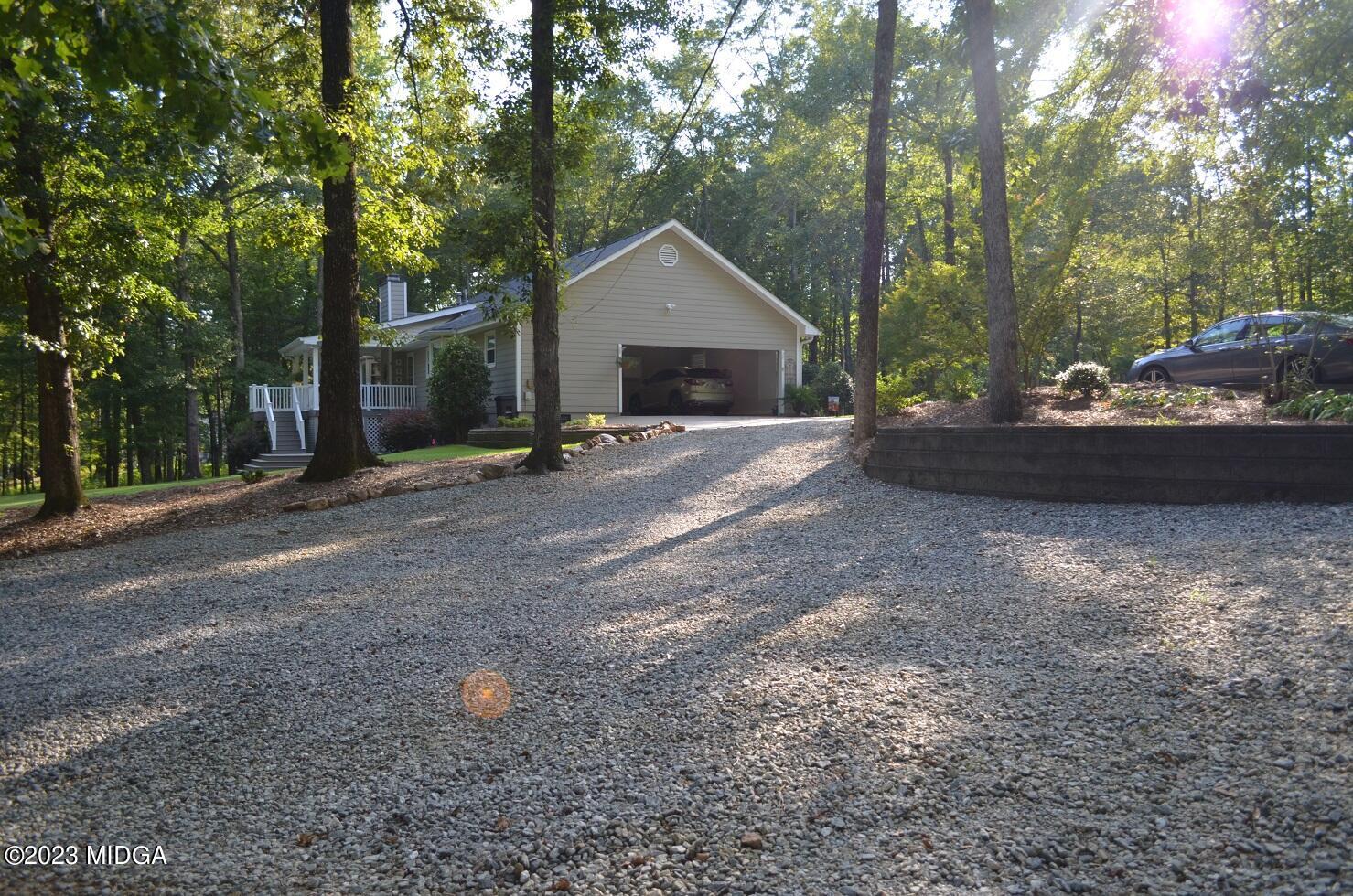 76 Riverside Landing Macon, GA 31210 - Photo 36 of 44 a view of a house with backyard and garden