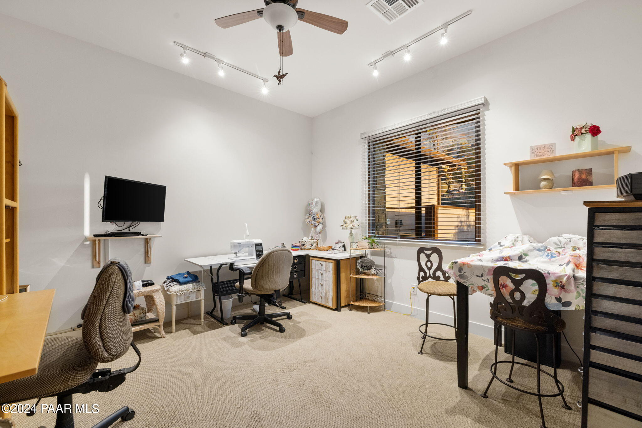 15500 North Talking Rock Ranch Road Prescott, AZ 86305 - Photo 35 of 66 a view of a workspace with furniture and a window