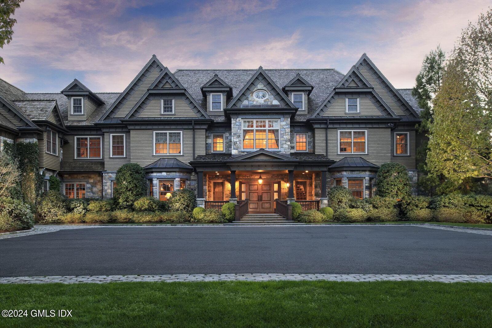 373 Taconic Road Greenwich, CT 06831 - Photo 1 of 1 a front view of a house with a yard