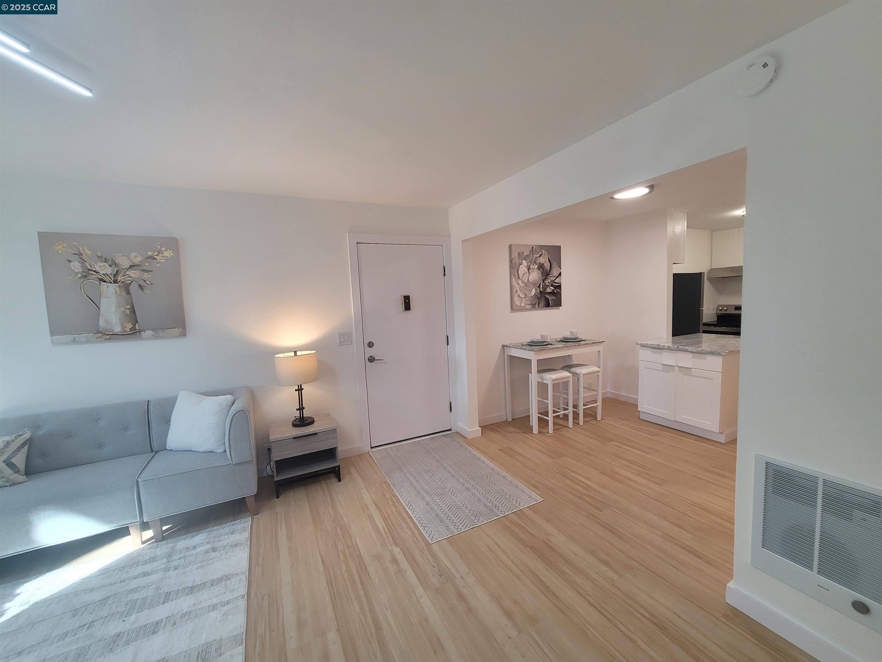 375 Camelback Road, Unit 23 Pleasant Hill, CA 94523 - Photo 11 of 58 a living room with furniture and a wooden floor