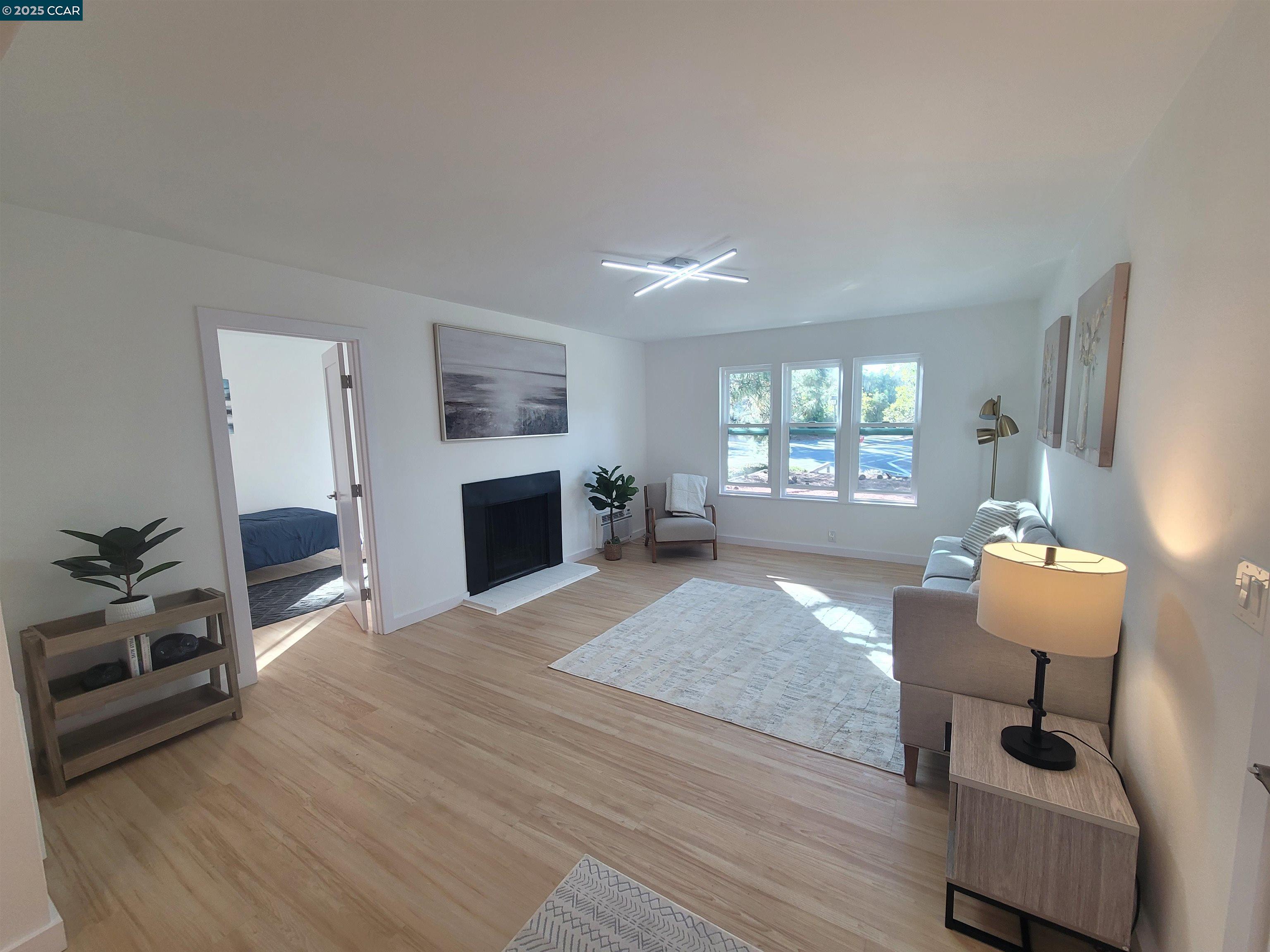 375 Camelback Road, Unit 23 Pleasant Hill, CA 94523 - Photo 19 of 42 a living room with furniture and a fireplace