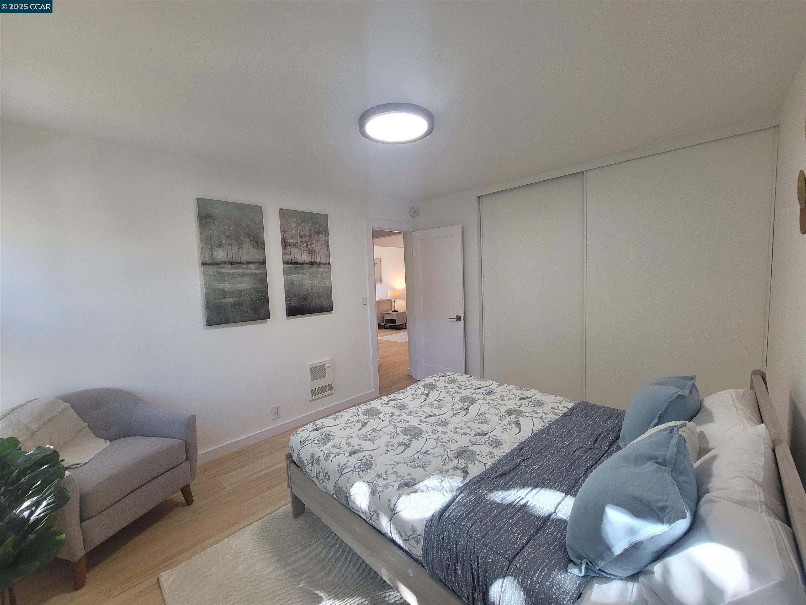 375 Camelback Road, Unit 23 Pleasant Hill, CA 94523 - Photo 25 of 42 a bedroom with a bed and a couch