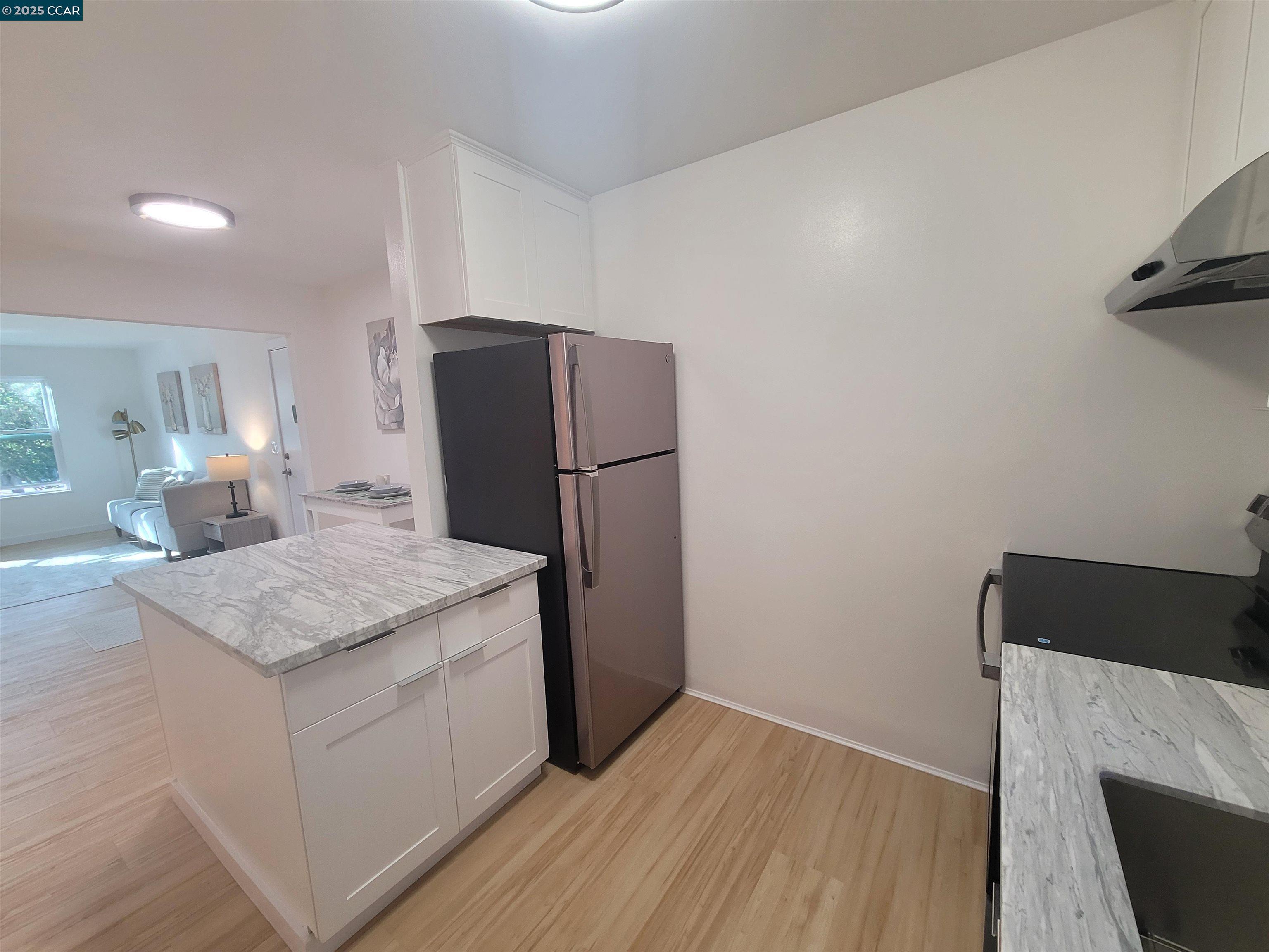 375 Camelback Road, Unit 23 Pleasant Hill, CA 94523 - Photo 25 of 58 a kitchen with a refrigerator and a stove top oven