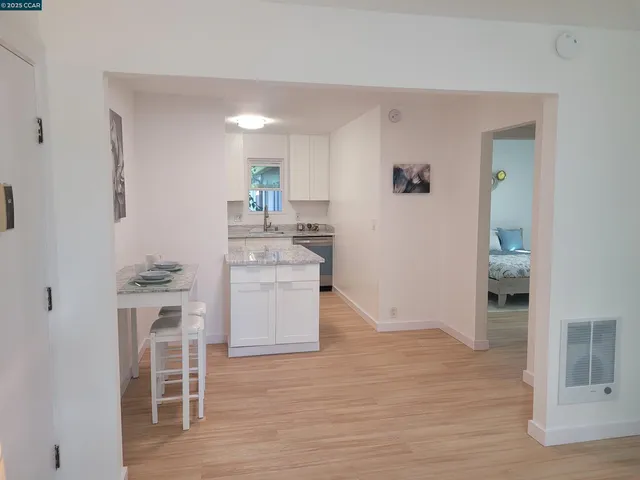 a kitchen with a refrigerator and countertop