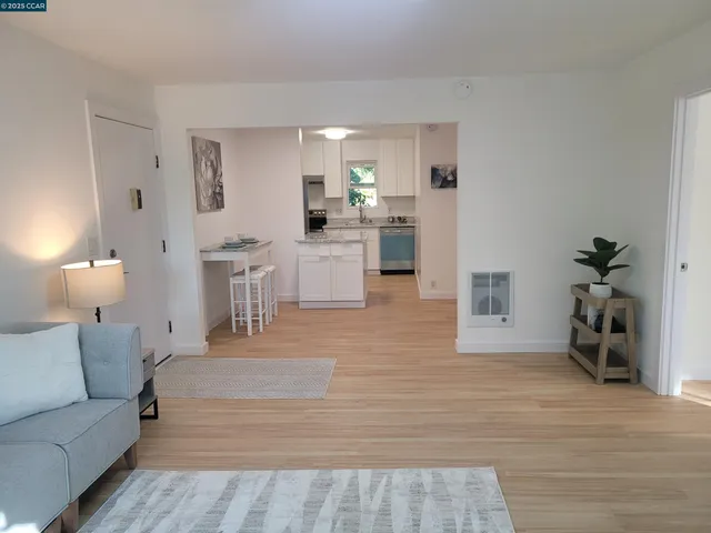a kitchen with a sink stove and refrigerator