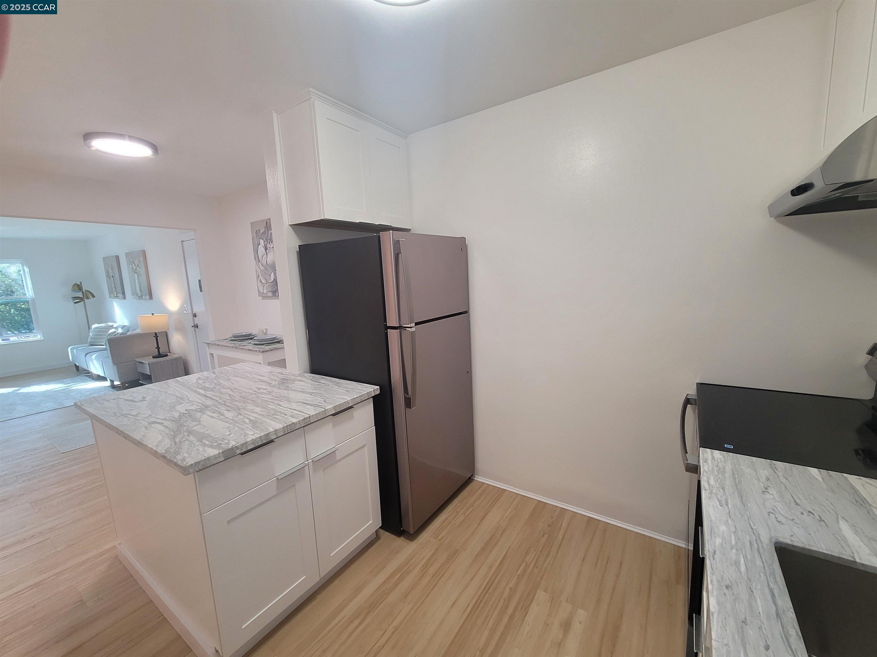 375 Camelback Road, Unit 23 Pleasant Hill, CA 94523 - Photo 30 of 42 a kitchen with a refrigerator and countertop