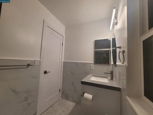 a bathroom with a shower and a bath tub