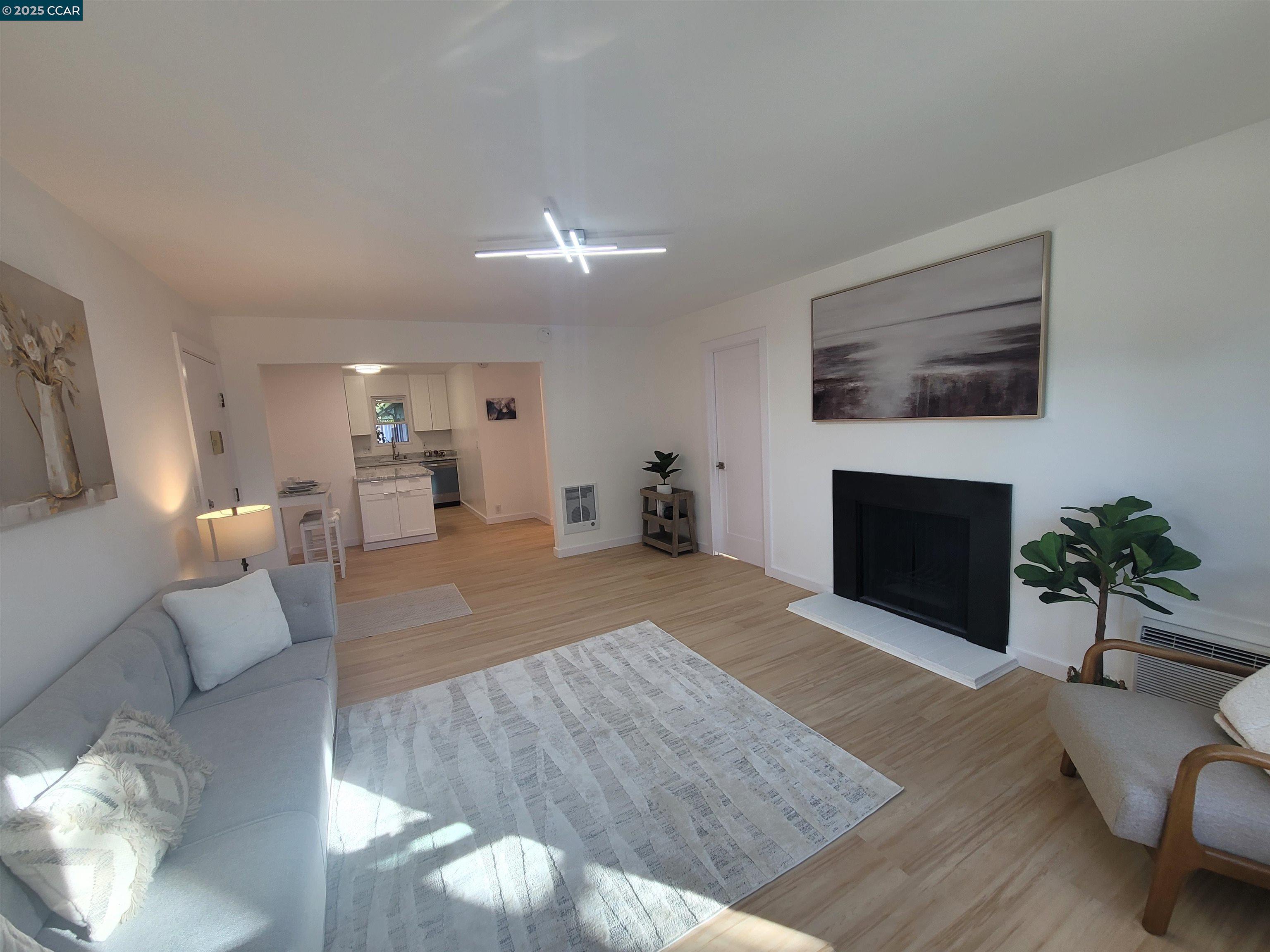 375 Camelback Road, Unit 23 Pleasant Hill, CA 94523 - Photo 4 of 58 a living room with furniture and a fireplace