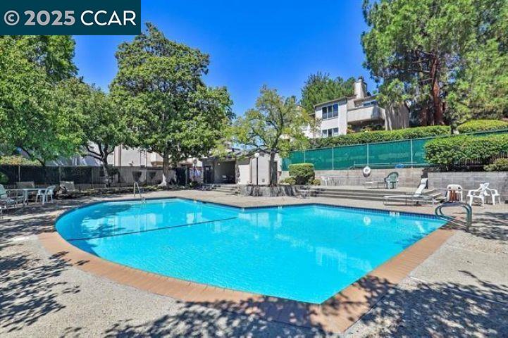 375 Camelback Road, Unit 23 Pleasant Hill, CA 94523 - Photo 42 of 42 a view of a swimming pool with chairs